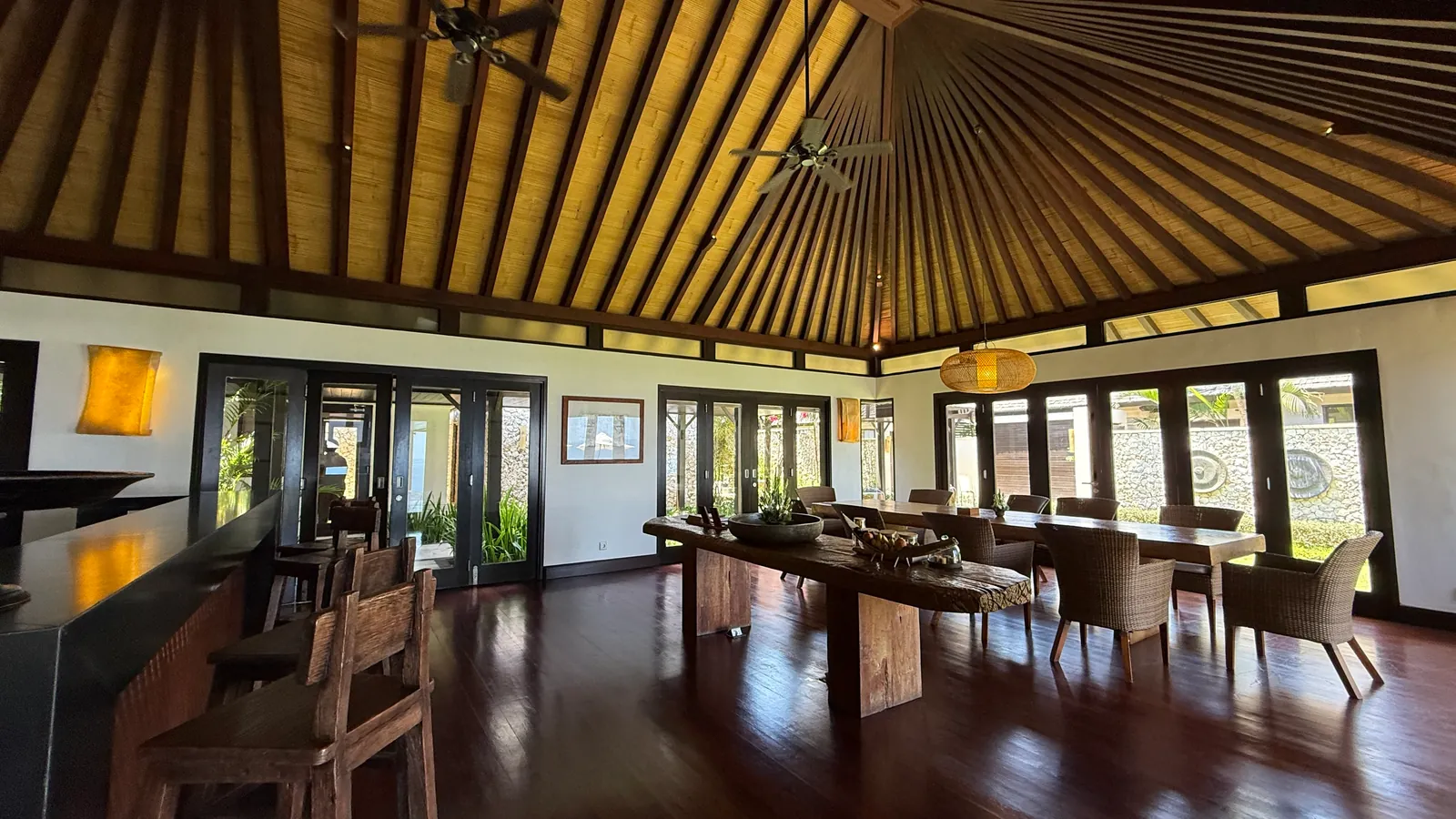 Villa dining pavilion with a vaulted timber ceiling at The Ungasan